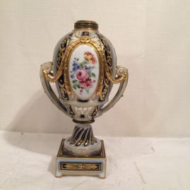 Bottom of fancy cobalt and gold porcelain oil lamp painted with portrait of Napoleon on one side and a flower bouquet on the other