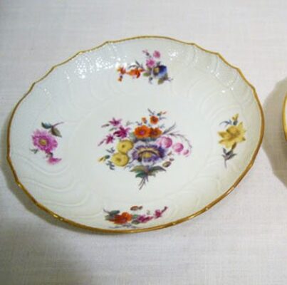 Two Berlin KPm serving bowls, each painted with different flower bouquet
