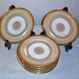 Set of twelve Cauldon luncheonj or dessert plates with raised gilding