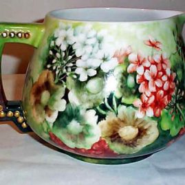 Other side of Limoges cider pitcher