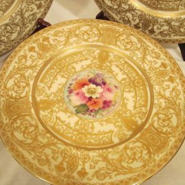 Close up of one of the Royal Worcester flowered dinner plates, each painted differentl