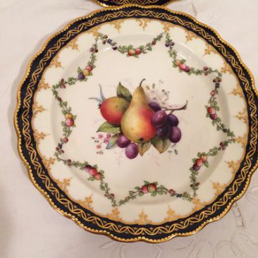 Close up of one of the twelve Royal Worcester fruit plates, each painted differently
