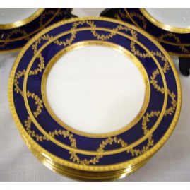 Close up of one of 12 beautiful Minton cobalt blue with raised gilding salad or dessert plates