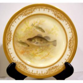 Close up of Royal Doulton Tiffany fish plates, museum quality, with raised gilding