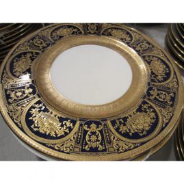 Fabulous set of ten Royal Doulton made for Tiffany dinner plates that are profusely gilded with raised gilding. size 10 1/4 inches. Sold.