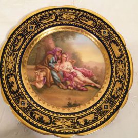 Royal Vienna cobalt plate with raised gilding and blue jeweling. entitled Venus, under glaze beehive mark, ladies with a cherub, 9 1/2 inches, artist signed Riemer