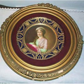 Royal Vienna framed cobalt plate of Mrs. Stone with raised gilding.