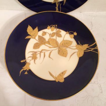 Set of ten Davenport cobalt plates each hand gilded with different butterflies and leaves