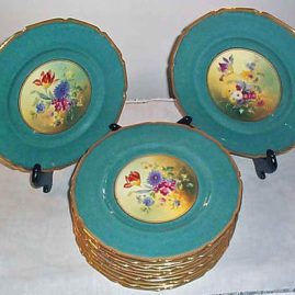 Royal Doulton flowered dinner plates,each painted differently