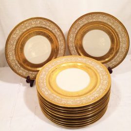 Set of twelve gilded Heinrich and Company service plates