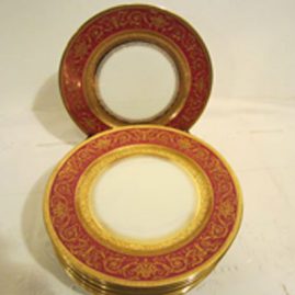 Set of twelve ruby Limoges luches or salad plates with raised gilding