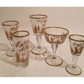Extensive set of antique gilded crystal stemware each painted differently with different pastoral scenes of ladies and lovers.