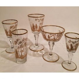 Extensive set of antique gilded crystal stemware each painted differently with different pastoral scenes of ladies and lovers.