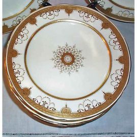 Close up of Minton cream and gilded dinner plate