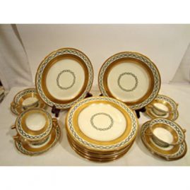 Set of 10 Minton made for Tiffany dessert or salad plates, with six matching cream soups and saucers. The cream soups can be sold with the set of plates or separately. Size of plates are 9 inches. Each piece with heavy gold decoration. Sold.