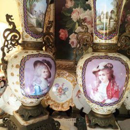 Pair of beautiful Palace Vases with portraits of beautiful ladies in front and different aesthetic movement paintings of birds, butterflies and flowers on the backs of the vases.