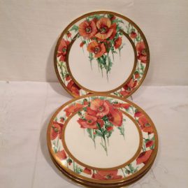 Two Minton poppy plates each painted differently