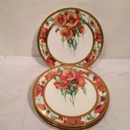 Four Minton poppy plates each painted differently