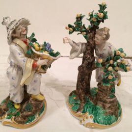 Pair of Nymphenburg figures of lady and man picking and carrying fruit