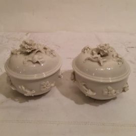 Two white Nymphenburg covered boxes with raised flower decoration