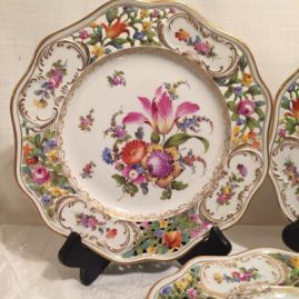 Close up of on of the set of sixteen Carl Thieme Potsnappel Dresden reticulated dinner plates