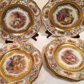 Set of eight Dresden reticulated and jeweled plates, each painted with different scenes of lovers