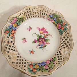 Set of ten reticulated dessert plates each painted with different bouquets