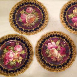 Set of twelve Cauldon hand painted rose plates