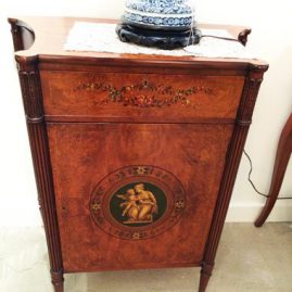 Satinwood cabinet decorated with a cherub and lady