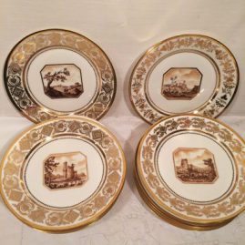 Set of twelve Sevres plates, each painted with different scenes