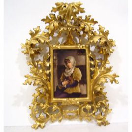 Porcelain plaque of lovely lady with book in Venetian frame