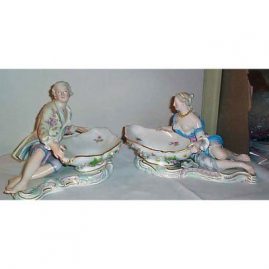 Pair of Meissen figural sweetmeat bowls with raised flowers