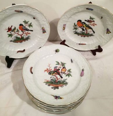 Meissen plates each painted differently with birds and bugs