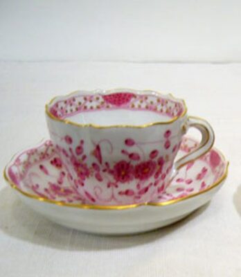 Seven Meissen purple Indian demitasse cups and saucers