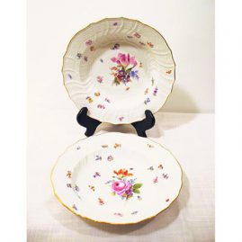 Meissen late 19th century dinner set with flowers and bugs, each plate painted differently