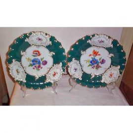 Pair of green Meissen chargers with flowers