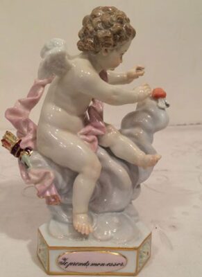 Meissen angel figurine putting a heat on a cloud