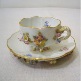 Rare Meissen cup and saucer, with raised flowers on all sides and on the bottom of the saucer