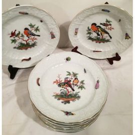 Set of nine Meissen plates each painted with different birds and bugs with white raised repousse design