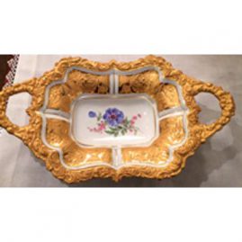 Two handled Meissen gilded charger with a blue flower and raised gold leaves and flowers decoration