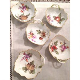 Five Meissen lead dishes painted with different fruits and flowers.