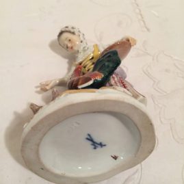 Mark on the Meissen figurine of lady feeding her chickens