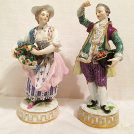 Pair of Meissen figures of a lady and gentleman with flowers