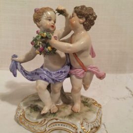 Meissen figure of girl and boy putti dancing