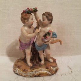 Meissen boy and girl putti with flowers and cornocopia