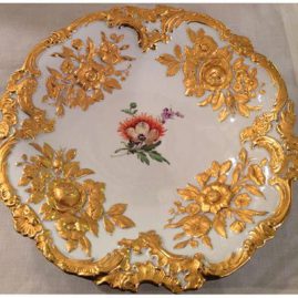 Large round Meissen gilded charger with painting of orange flower and raised gold flower decoration