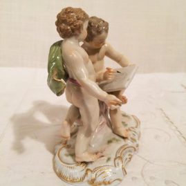 Side of Meissen figural group of artists