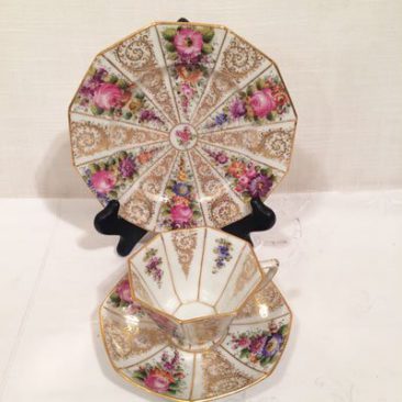 This shows the inside of the cups of the set of twelve Wiswall Dresden octagonal cups and saucers and cake plates