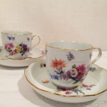 Set of six Meissen cups and saucers each painted with different flowers