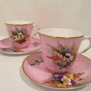 Four pink Royal Worcester cups and saucers